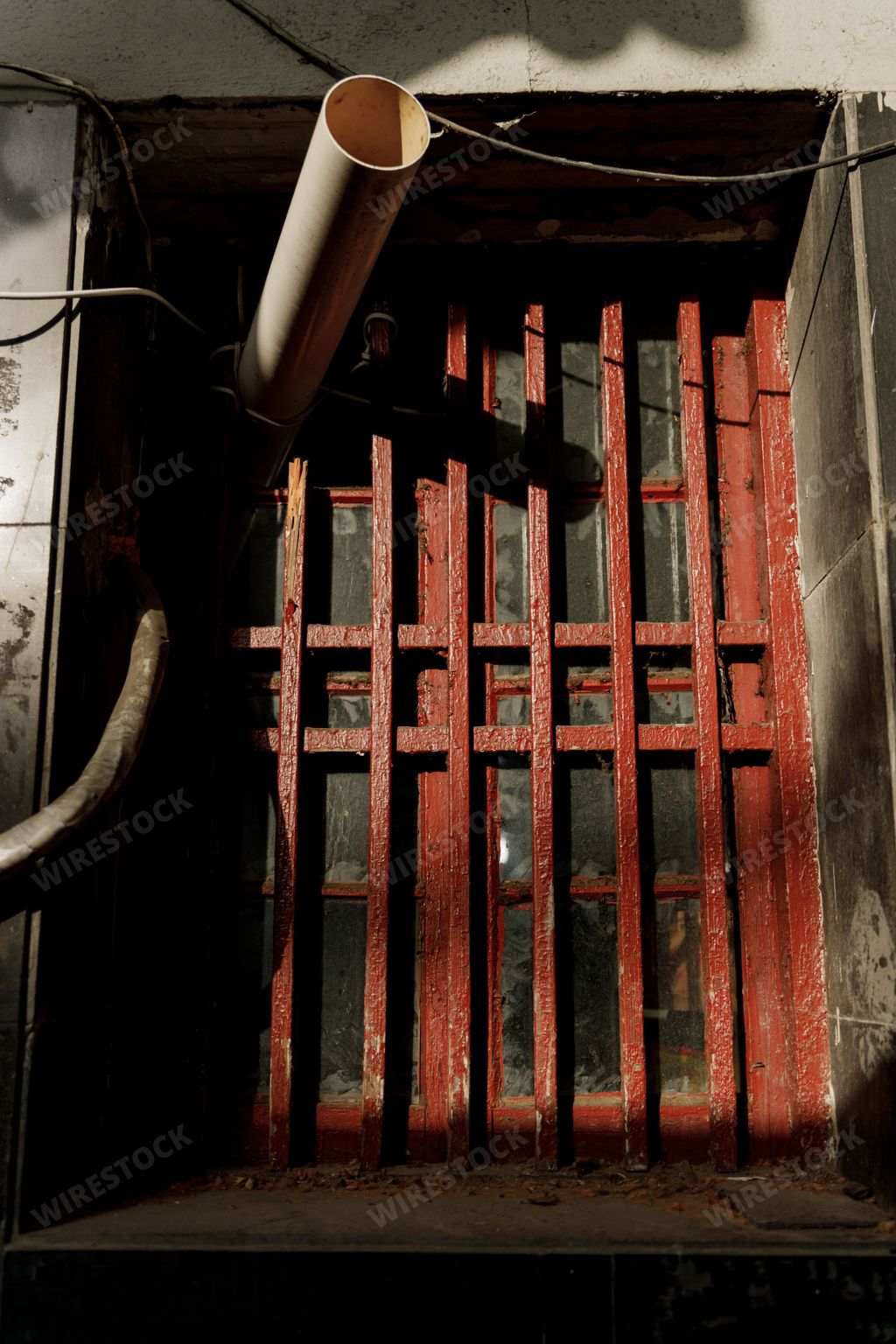 A vertical shot of an old metal door in Shanghai, China