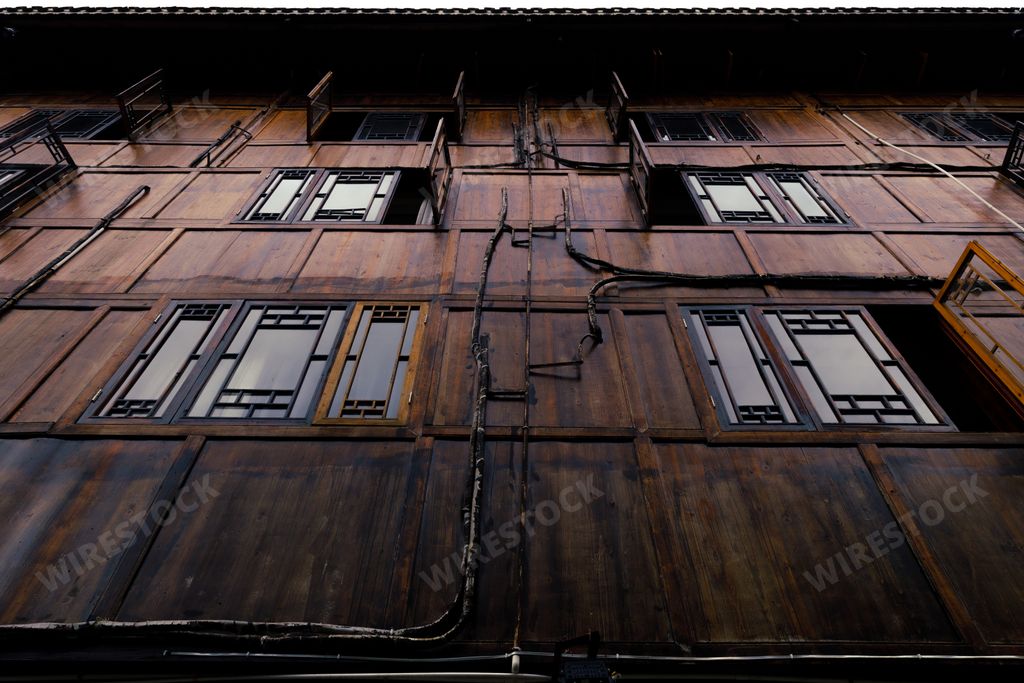 A low angle shot of the facade of the old traditional houses in Langde Miao Ethnic Minority Village, Guizhou Province, China