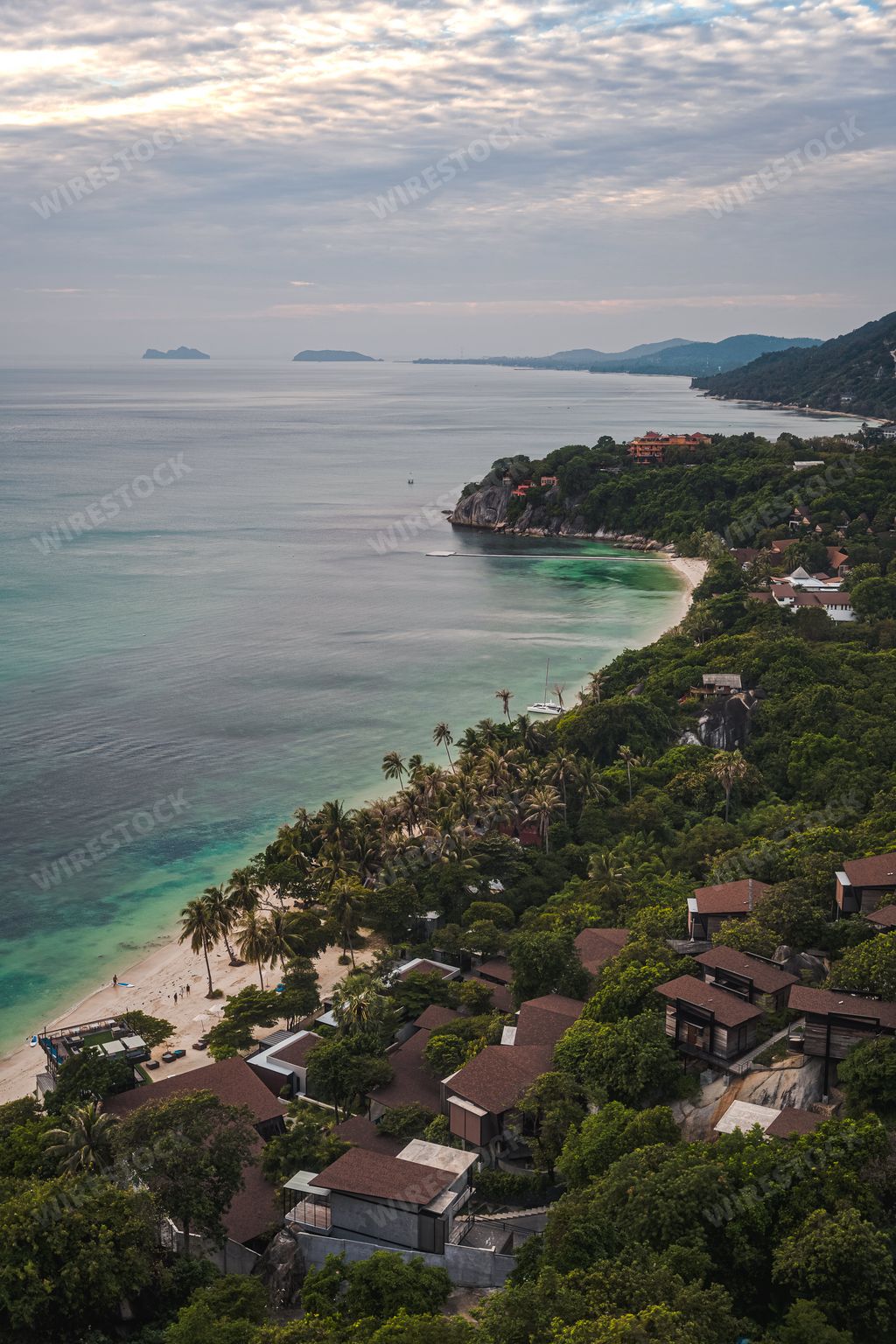 A vertical shot of Haad Rin in Koh Phangan island under bright sky