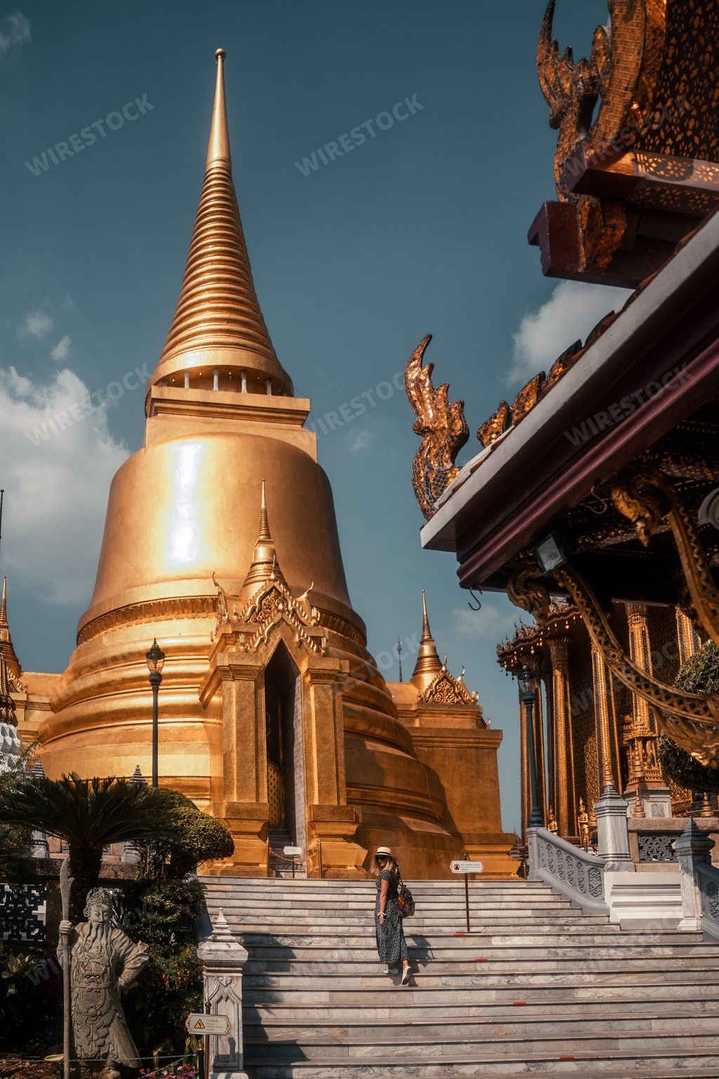 A young elegant female posing in Wat Phra Kaew, Temple of the Emerald Buddha, Thailand