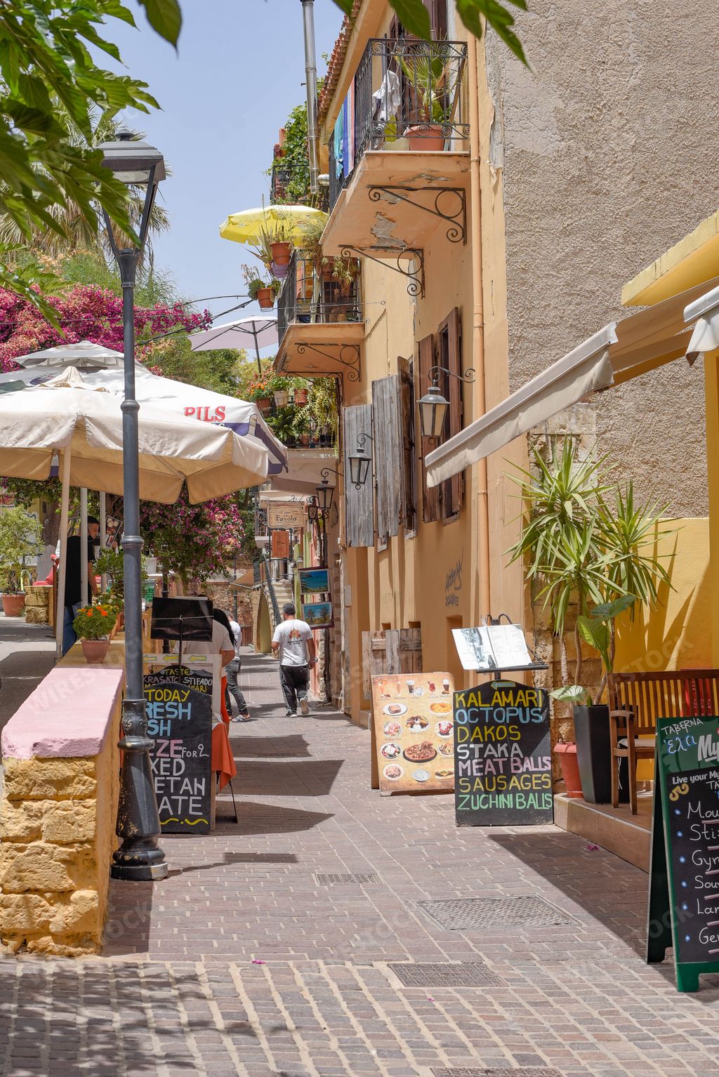 A cozy narrow street with attractions in the city of Chania, Crete, Greece