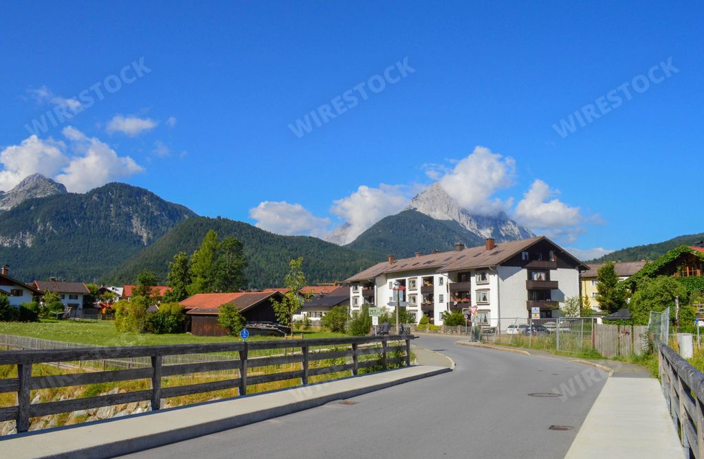 A beautiful view of cottages and green-covered mountains