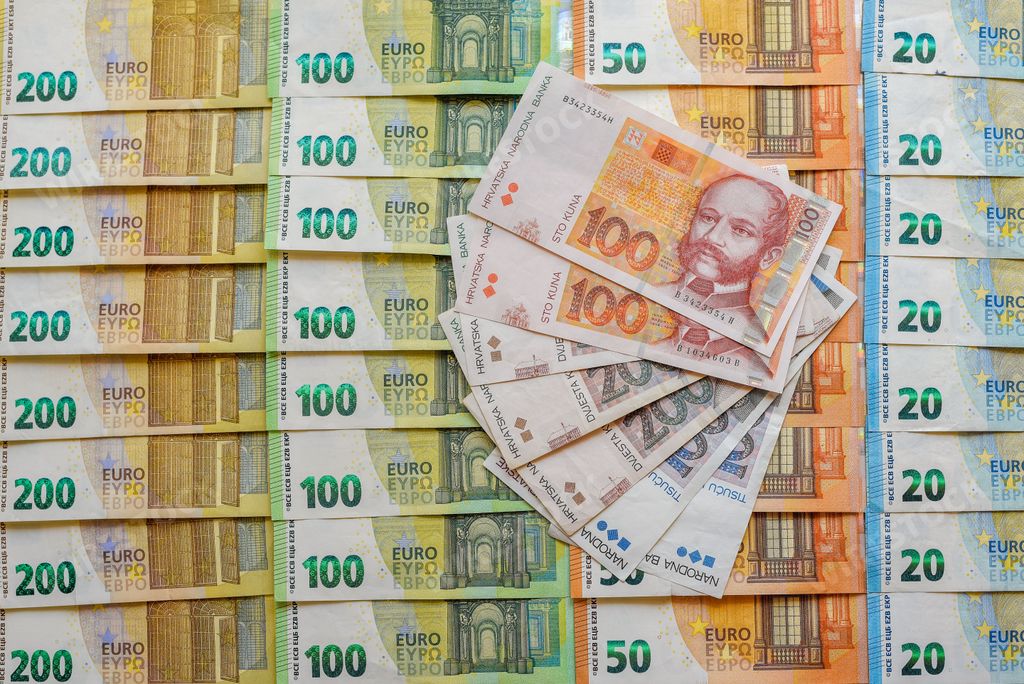 A closeup shot of Euro and Croatian kuna banknotes stacked in order