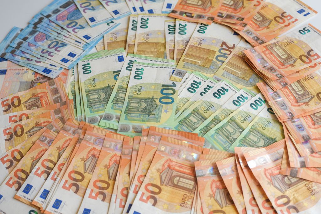 The euro currency of the domination of 20, 50, 100 and 200 rounded on the table.