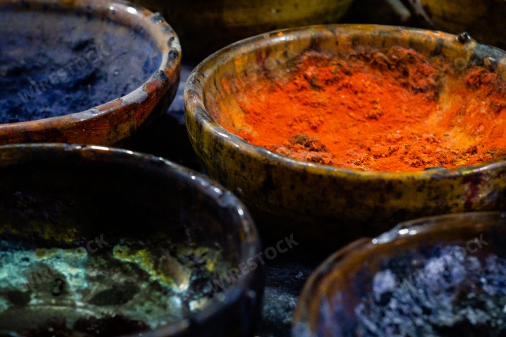 Multicolored condiments put into the bowls
