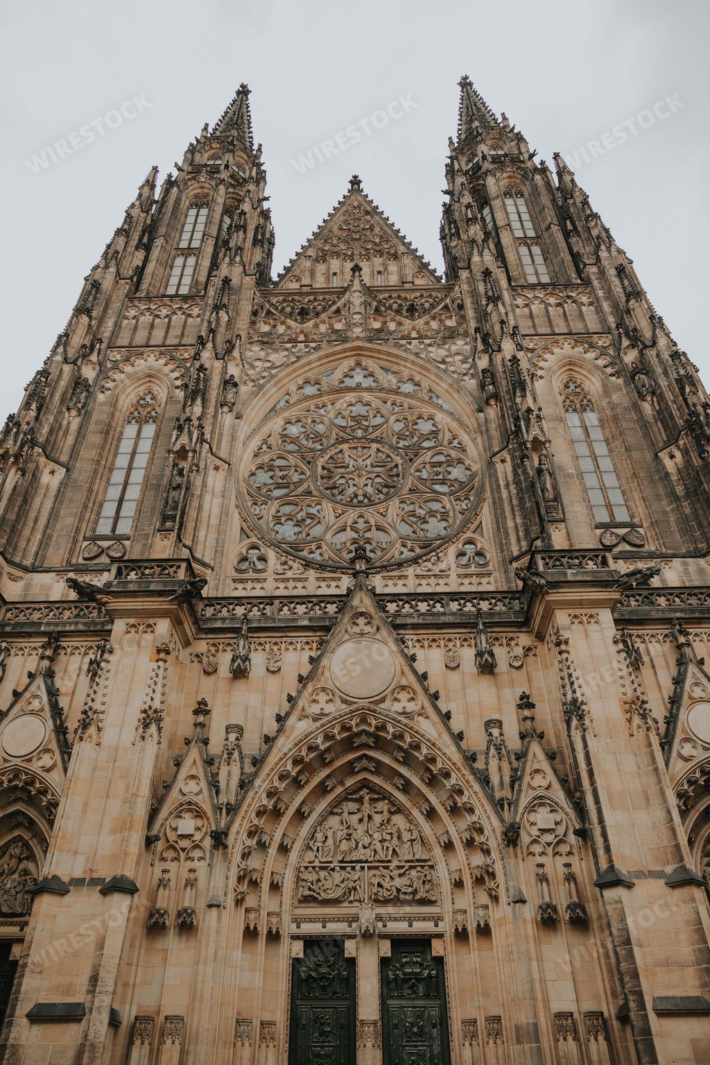 A low-angle vertical shot of St. Vitus Cathedral in Prague, Czech Republic